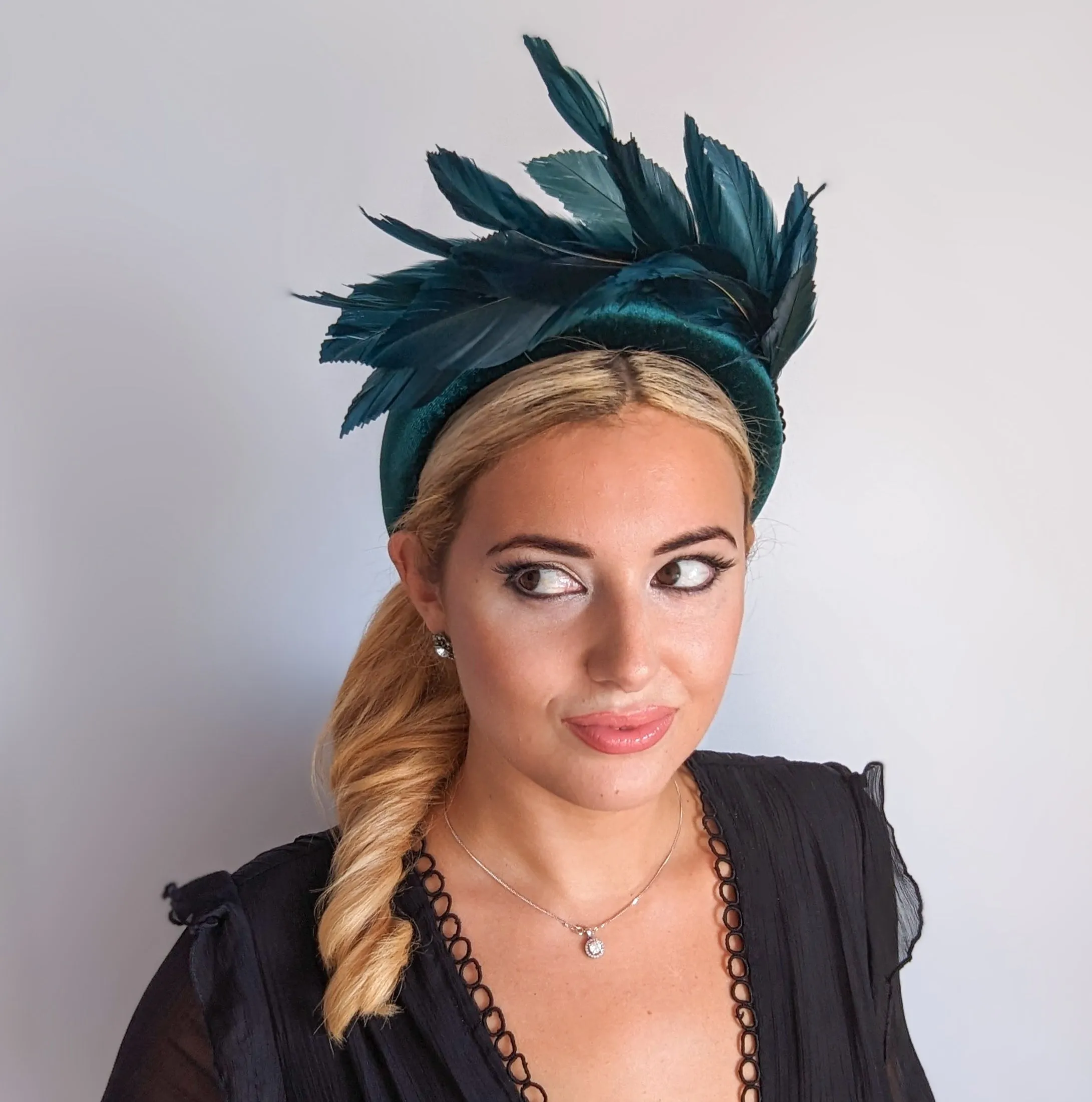 Dark emerald green feather padded velvet headband fascinator
