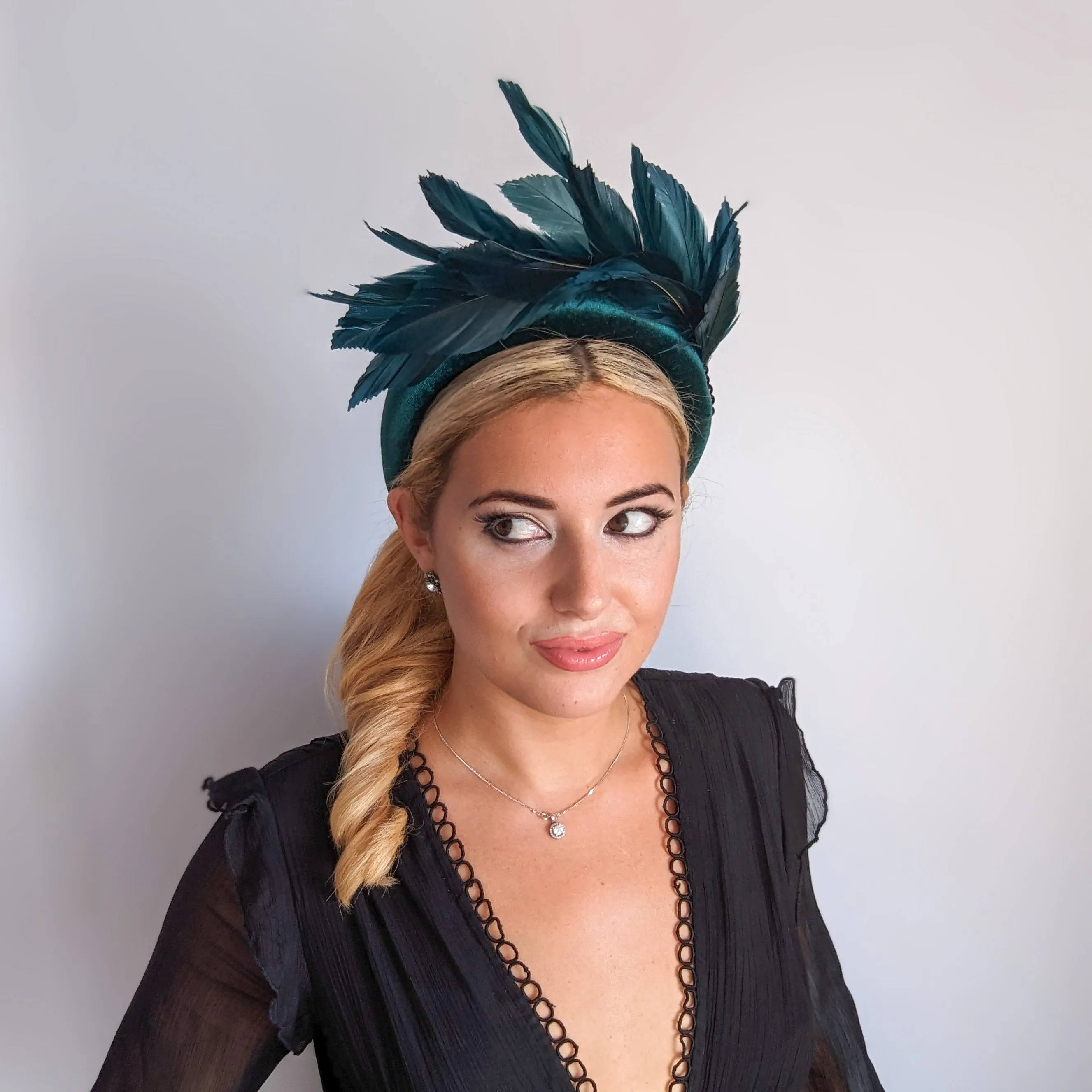 Dark emerald green feather padded velvet headband fascinator