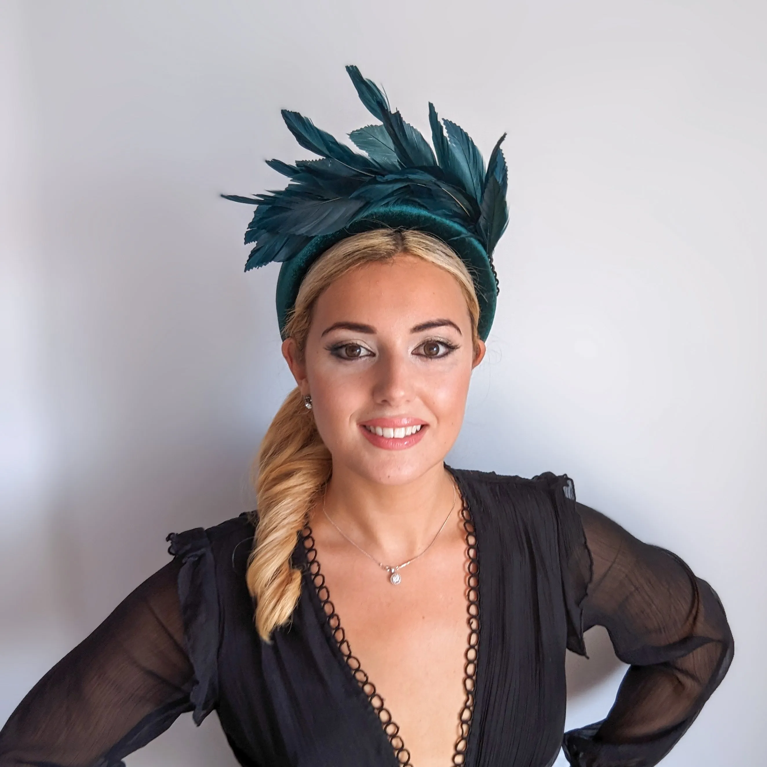 Dark emerald green feather padded velvet headband fascinator