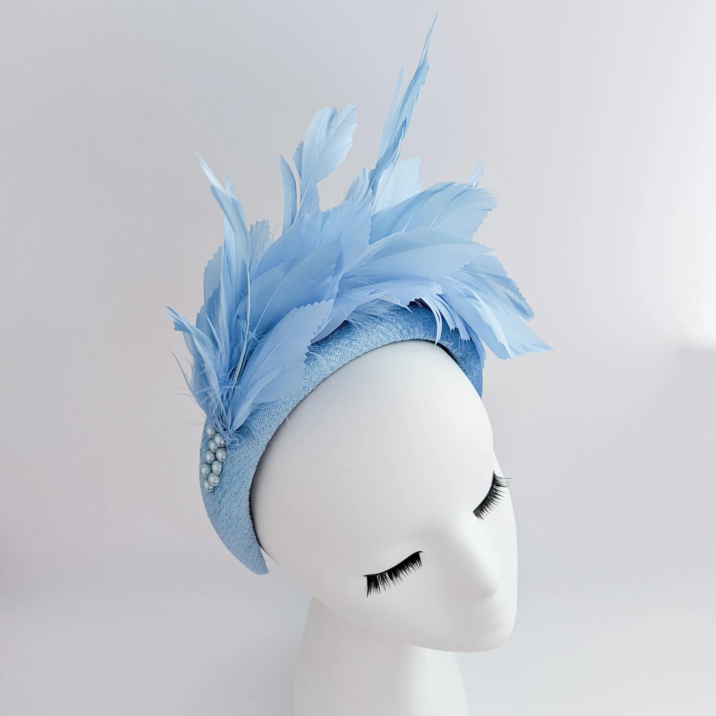 Light cornflower blue feather padded velvet headband fascinator
